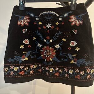 Black embroidered mini skirt